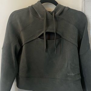 This is a cropped, green hoodie from lululemon. This is a size 4.
